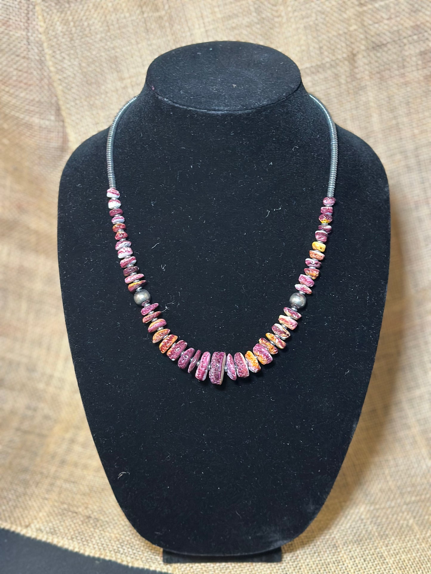 22 Inch graduated deep purple spiny and sterling silver pearls