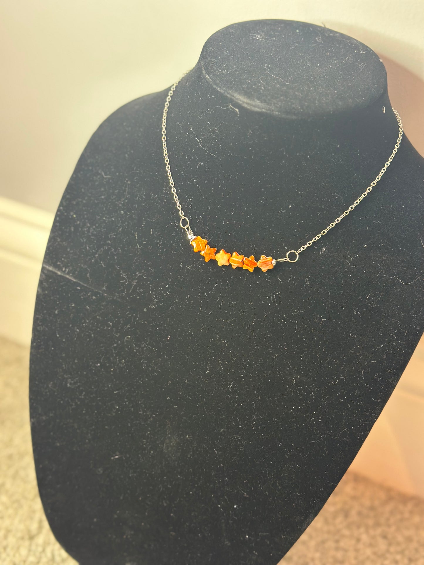 orange spiny star chain necklace