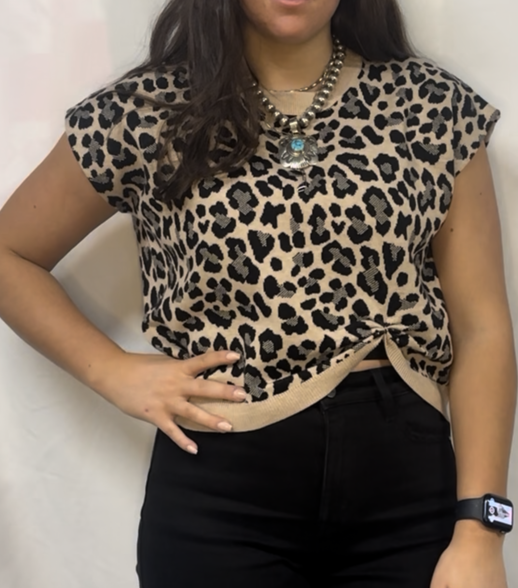 Drop shoulder leopard sweater top with knot detail.