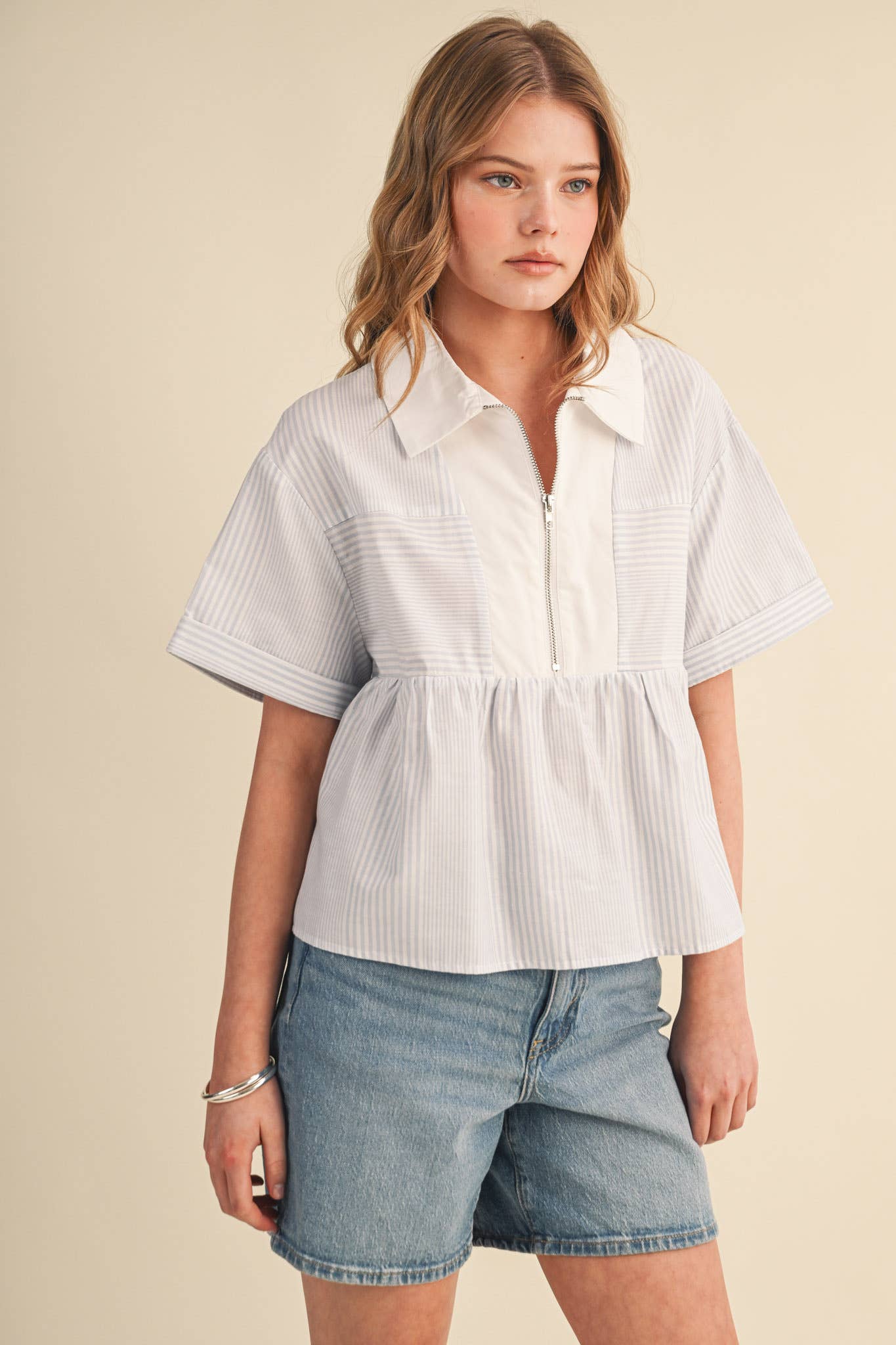 STRIPED HALF ZIP BABYDOLL TOP