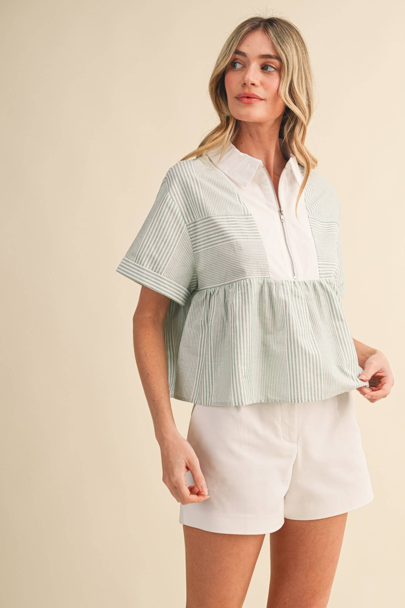 STRIPED HALF ZIP BABYDOLL TOP