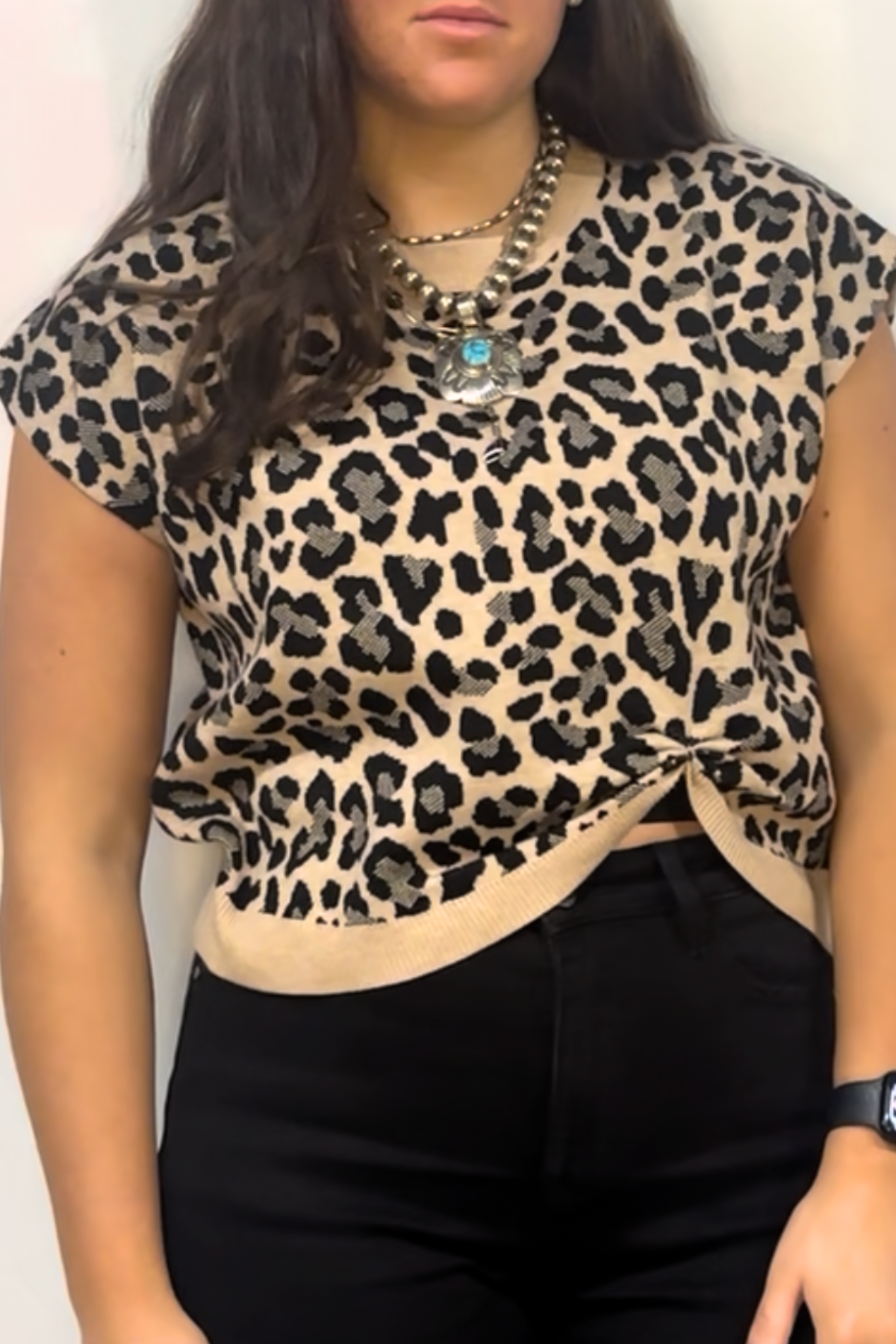 Drop shoulder leopard sweater top with knot detail.