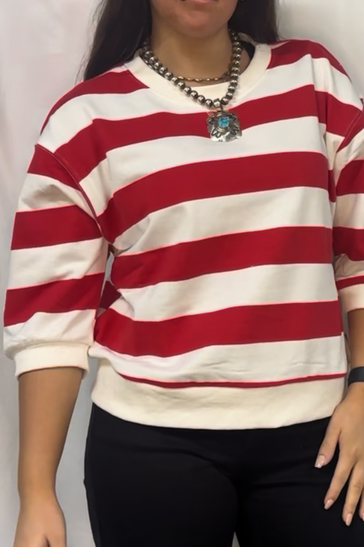 Drop shoulder 3/4 sleeves bold stripe casual top with V-notch.