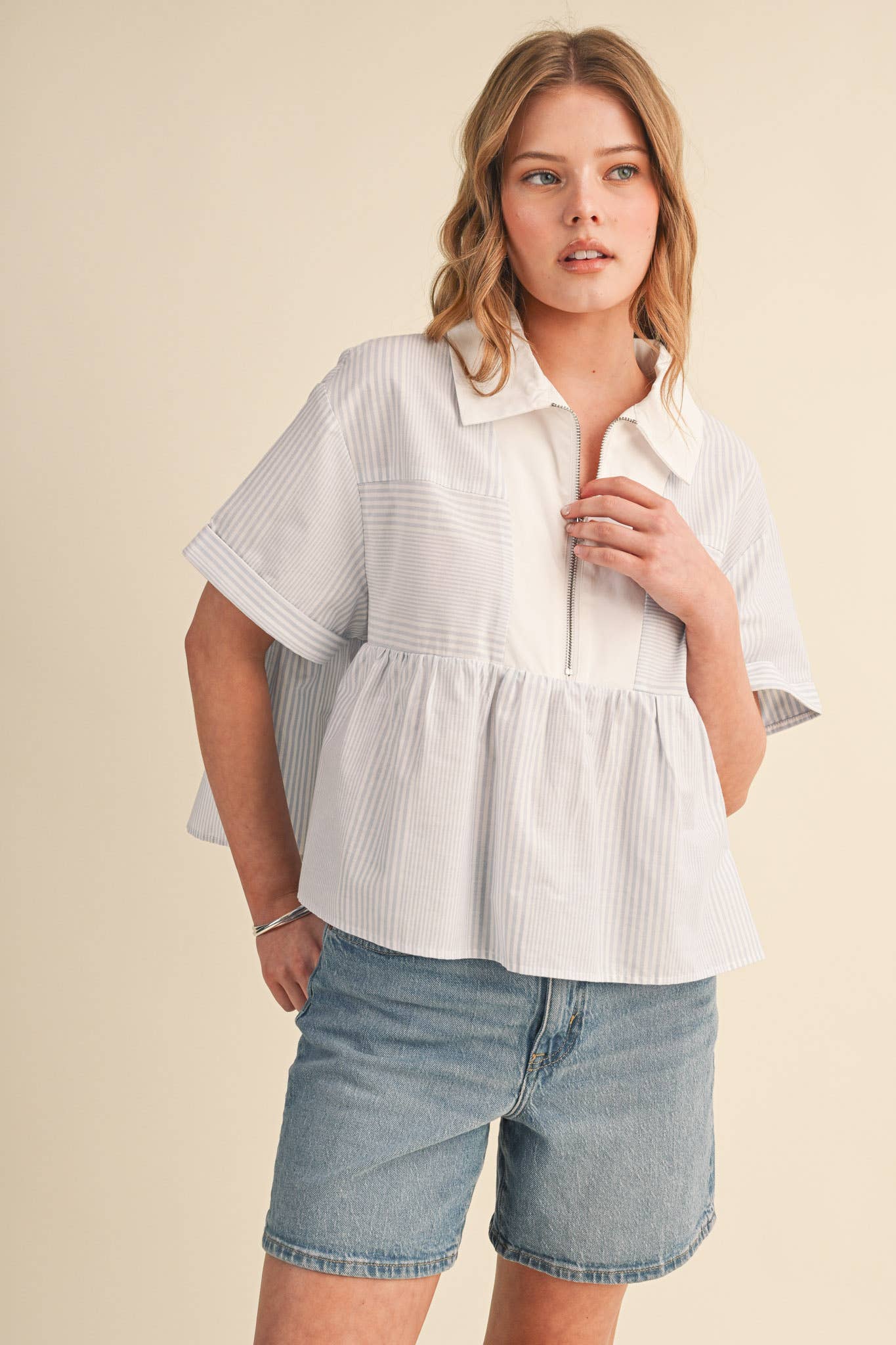 STRIPED HALF ZIP BABYDOLL TOP