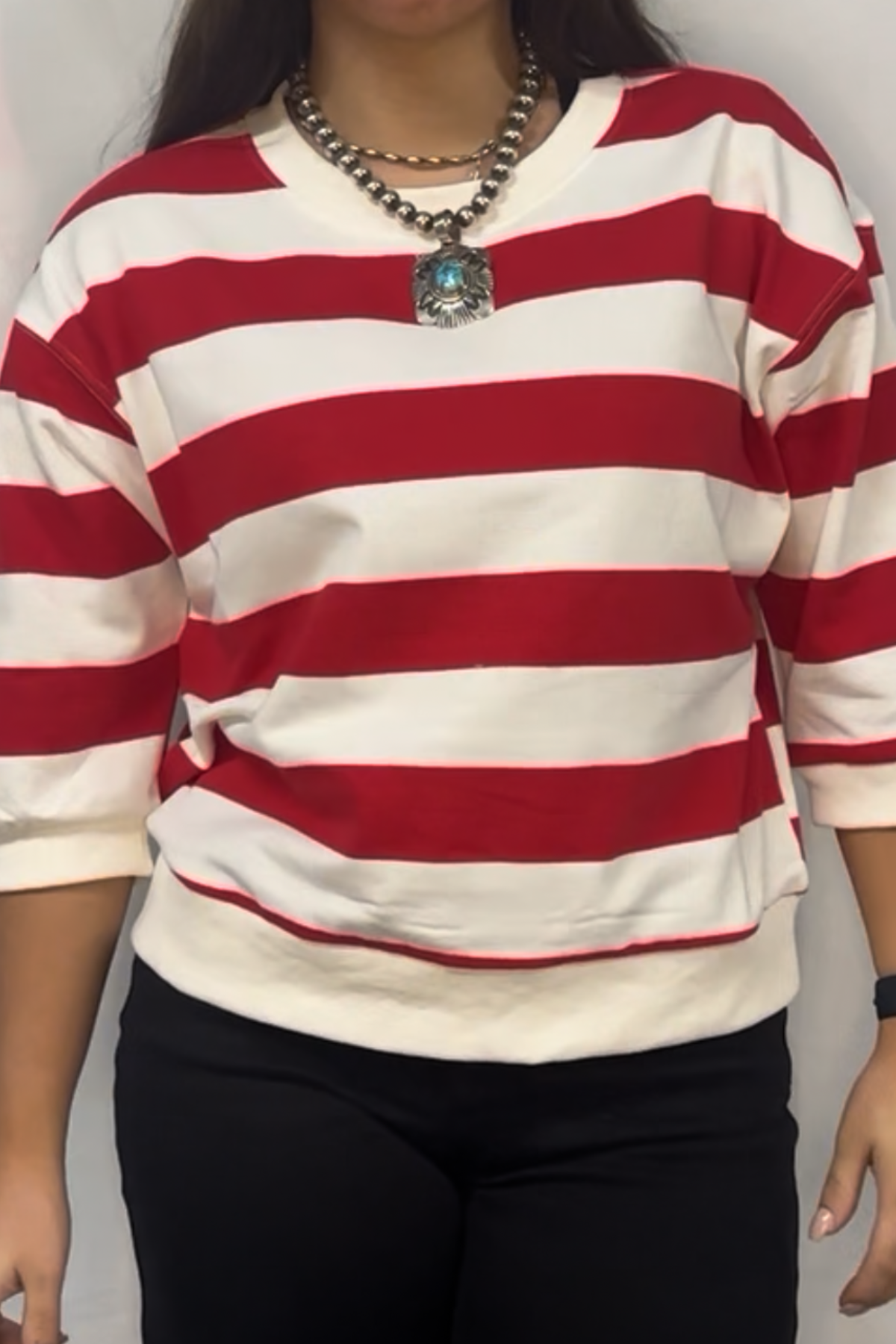 Drop shoulder 3/4 sleeves bold stripe casual top with V-notch.