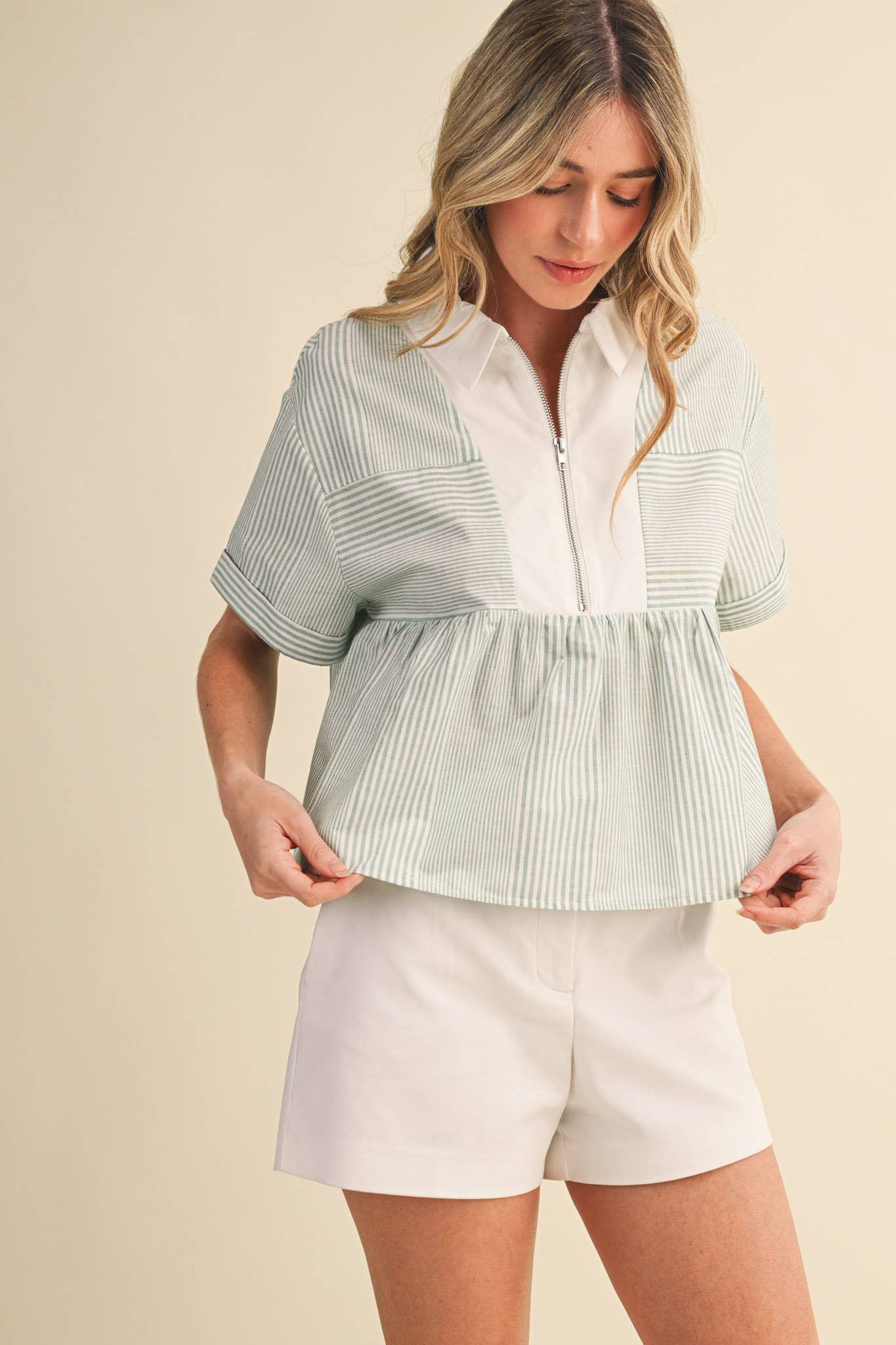 STRIPED HALF ZIP BABYDOLL TOP