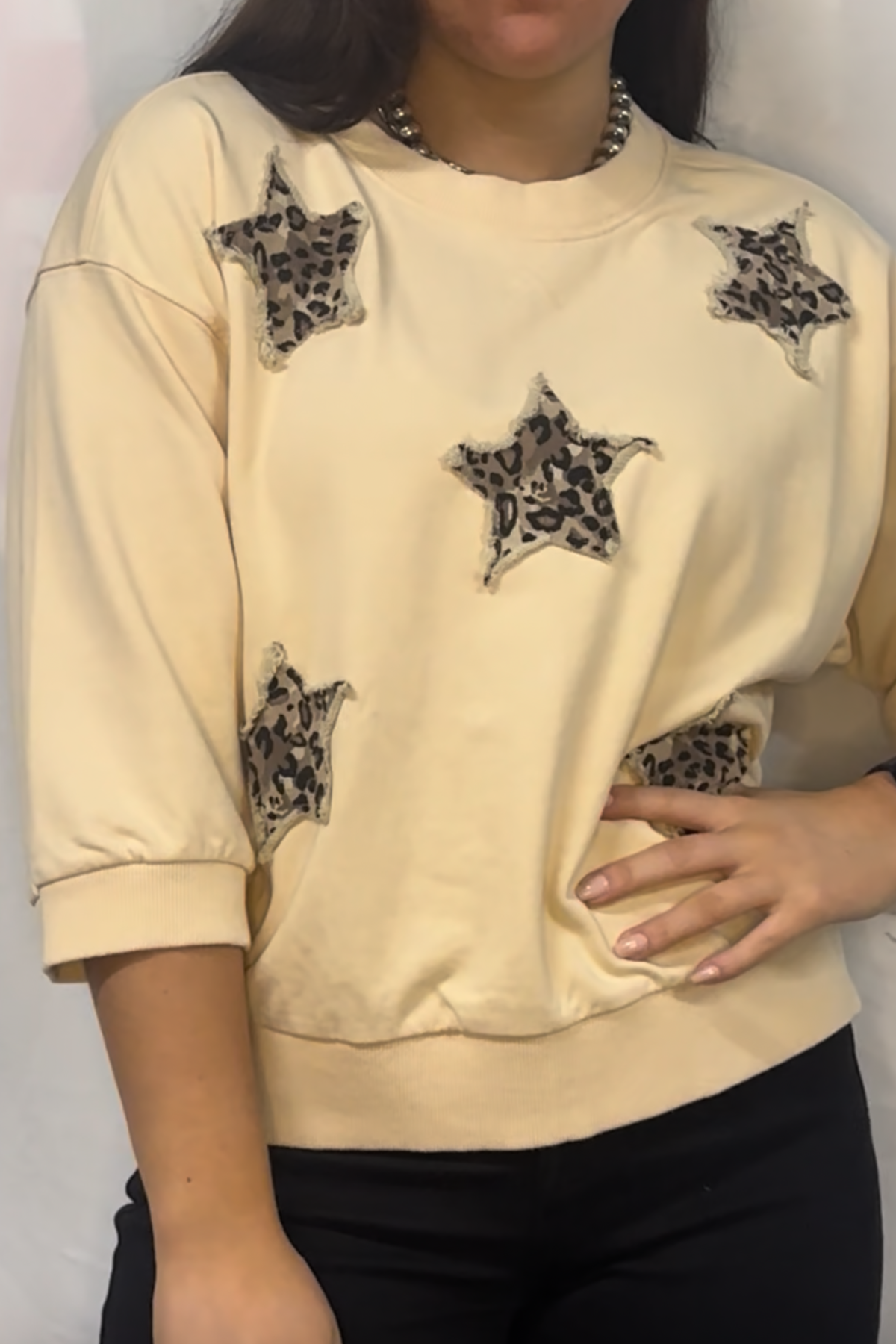 3/4 sleeves washed casual top with leopard star patch detail.
