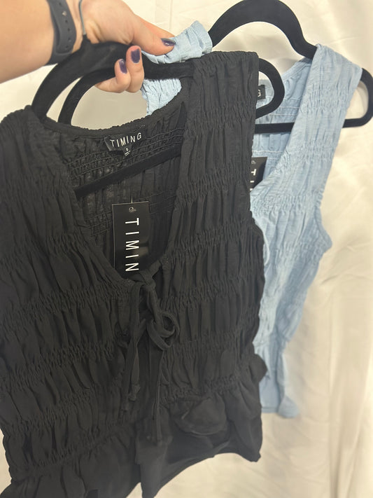 SMOCKED RUFFLED SLEEVELESS TOP WITH FRONT TIES *