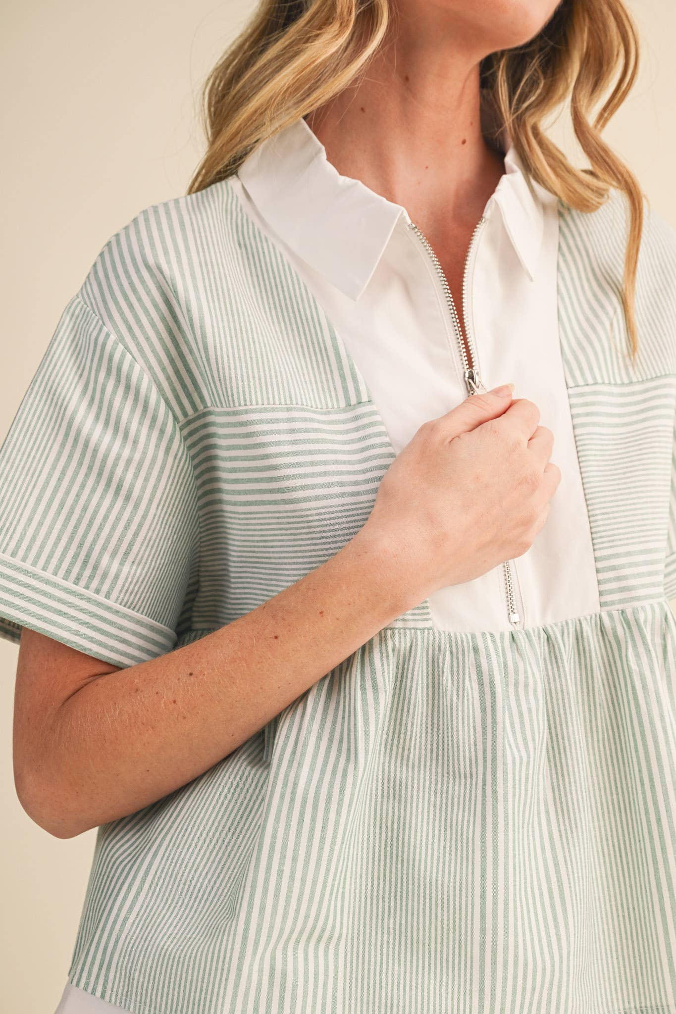 STRIPED HALF ZIP BABYDOLL TOP