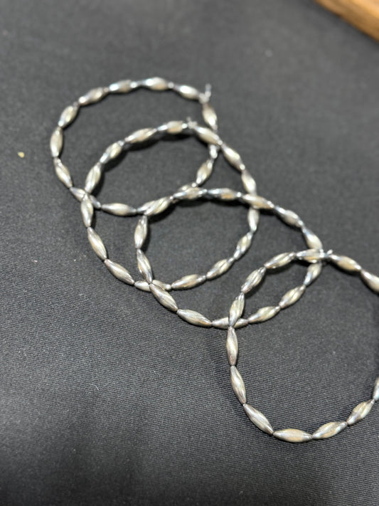 Handstrung sterling silver torpedo pearl stretch bracelet