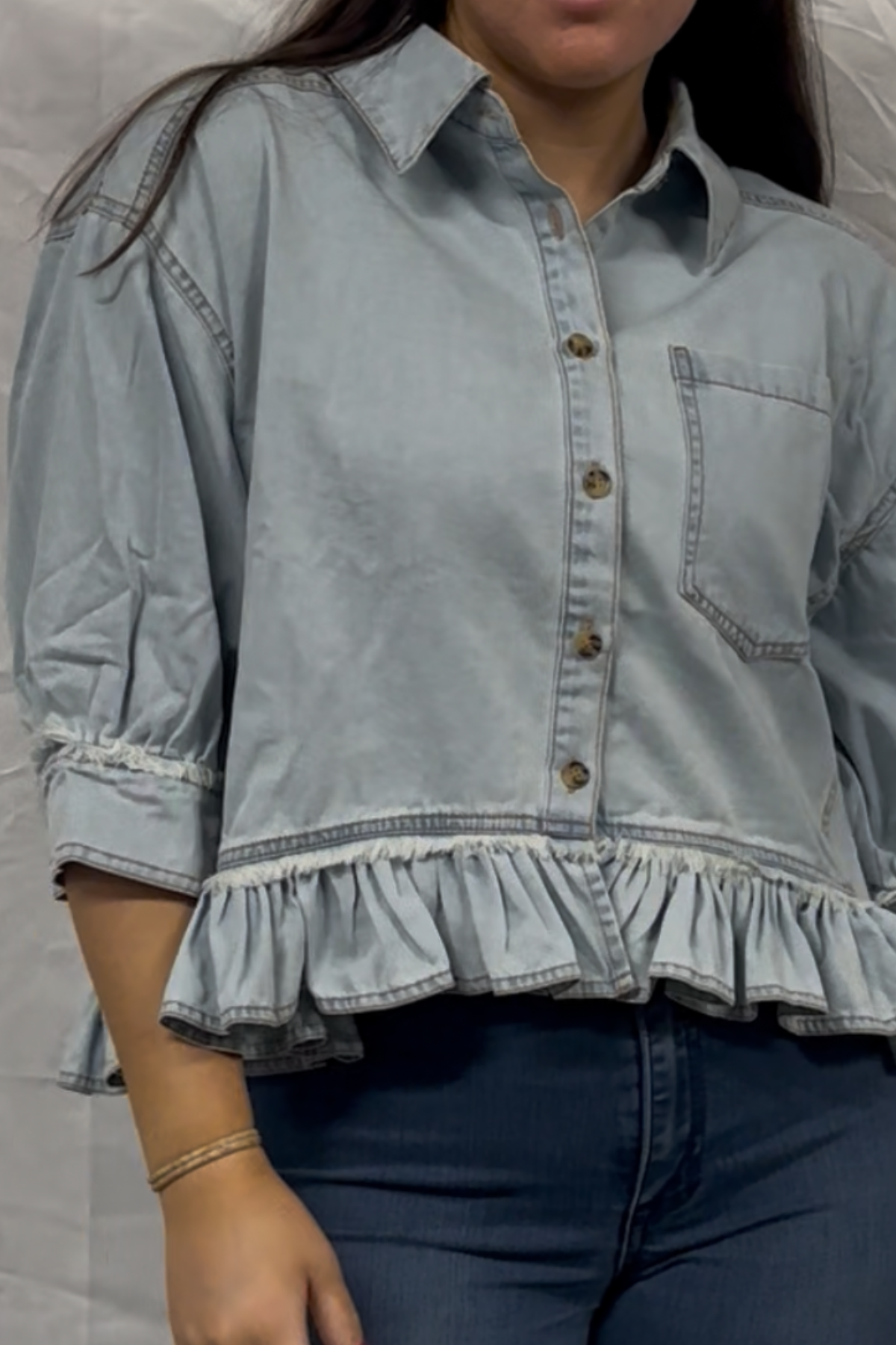 Washed denim ruffled hem button up