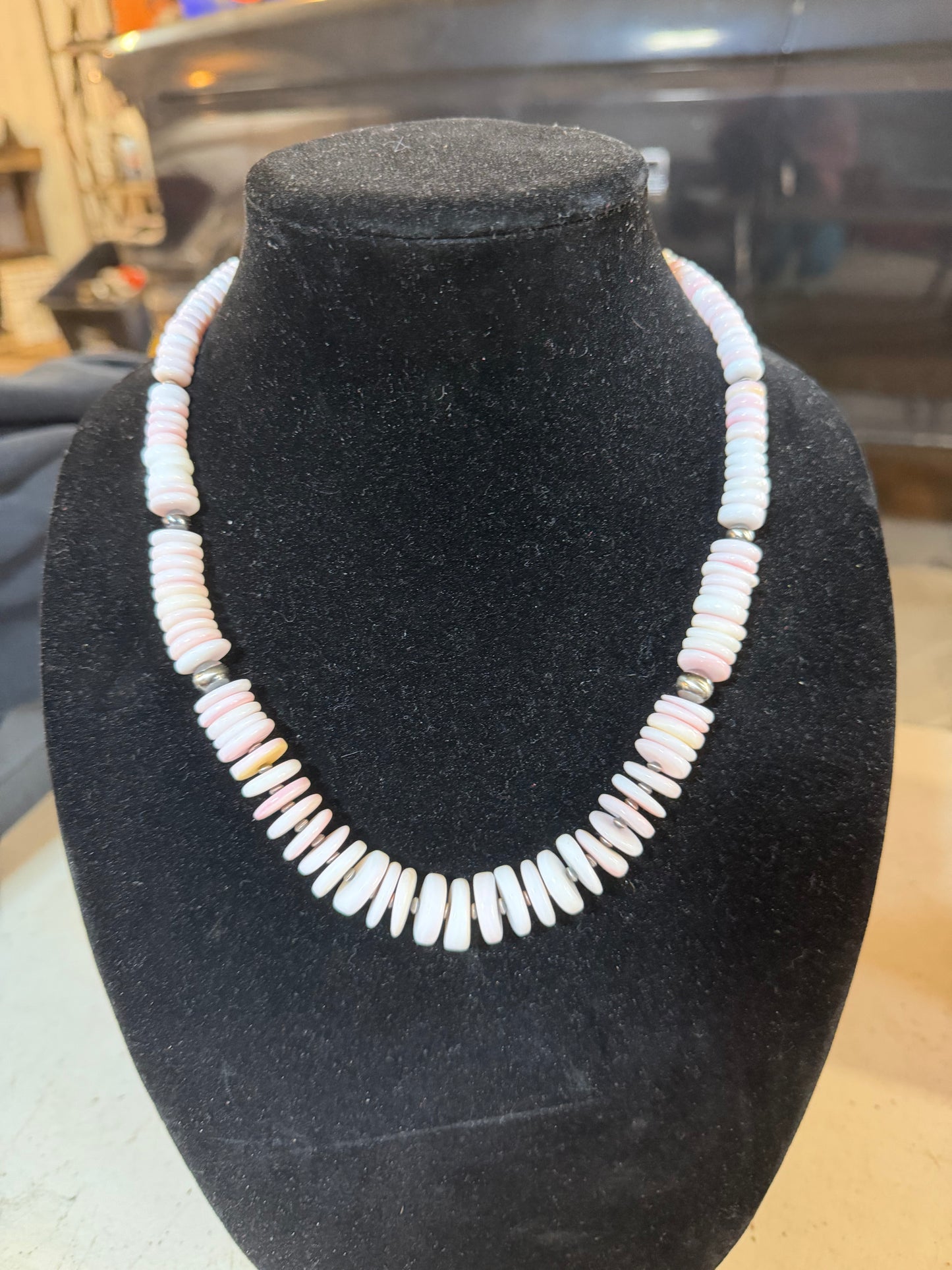 Graduated pink conch necklace