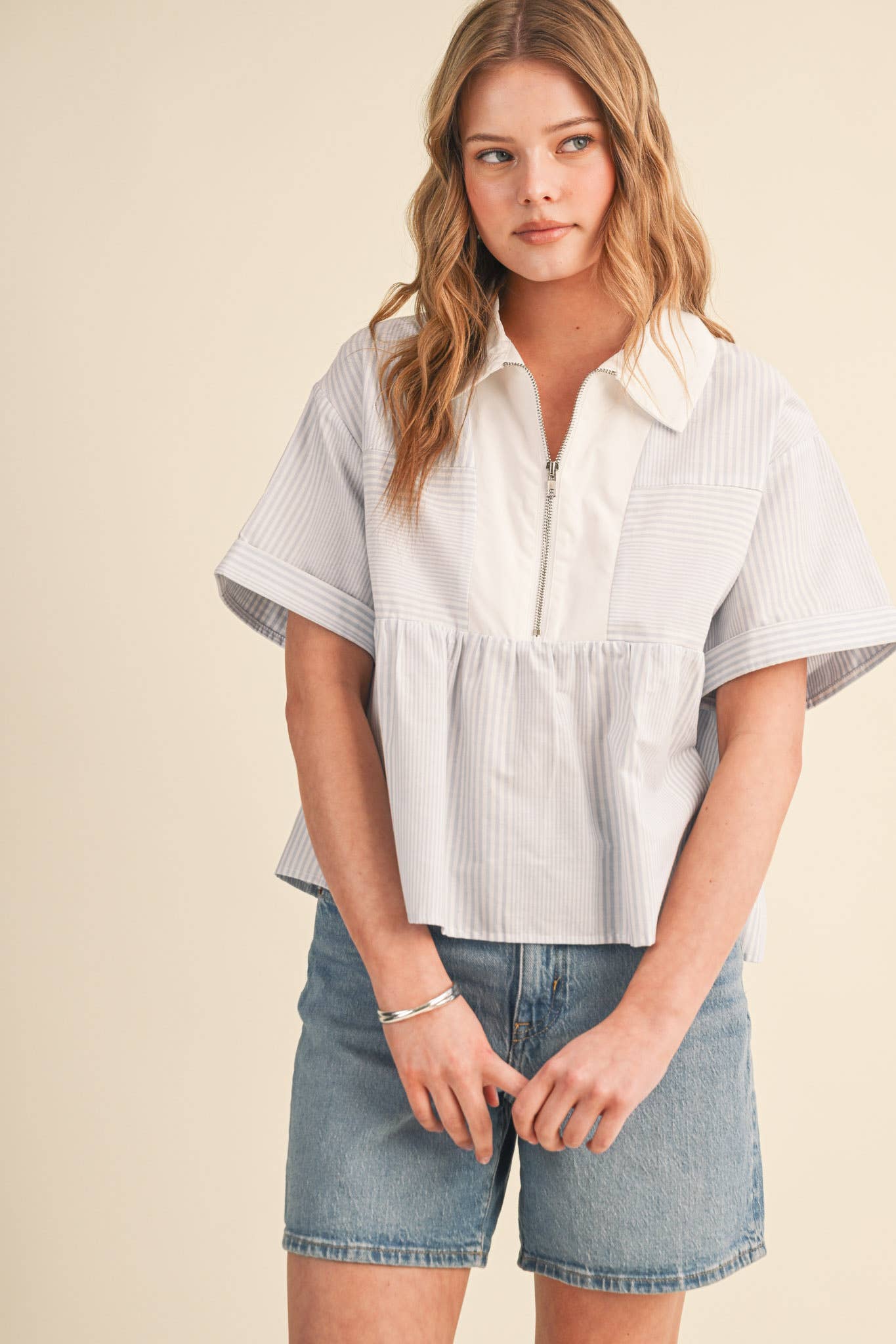 STRIPED HALF ZIP BABYDOLL TOP
