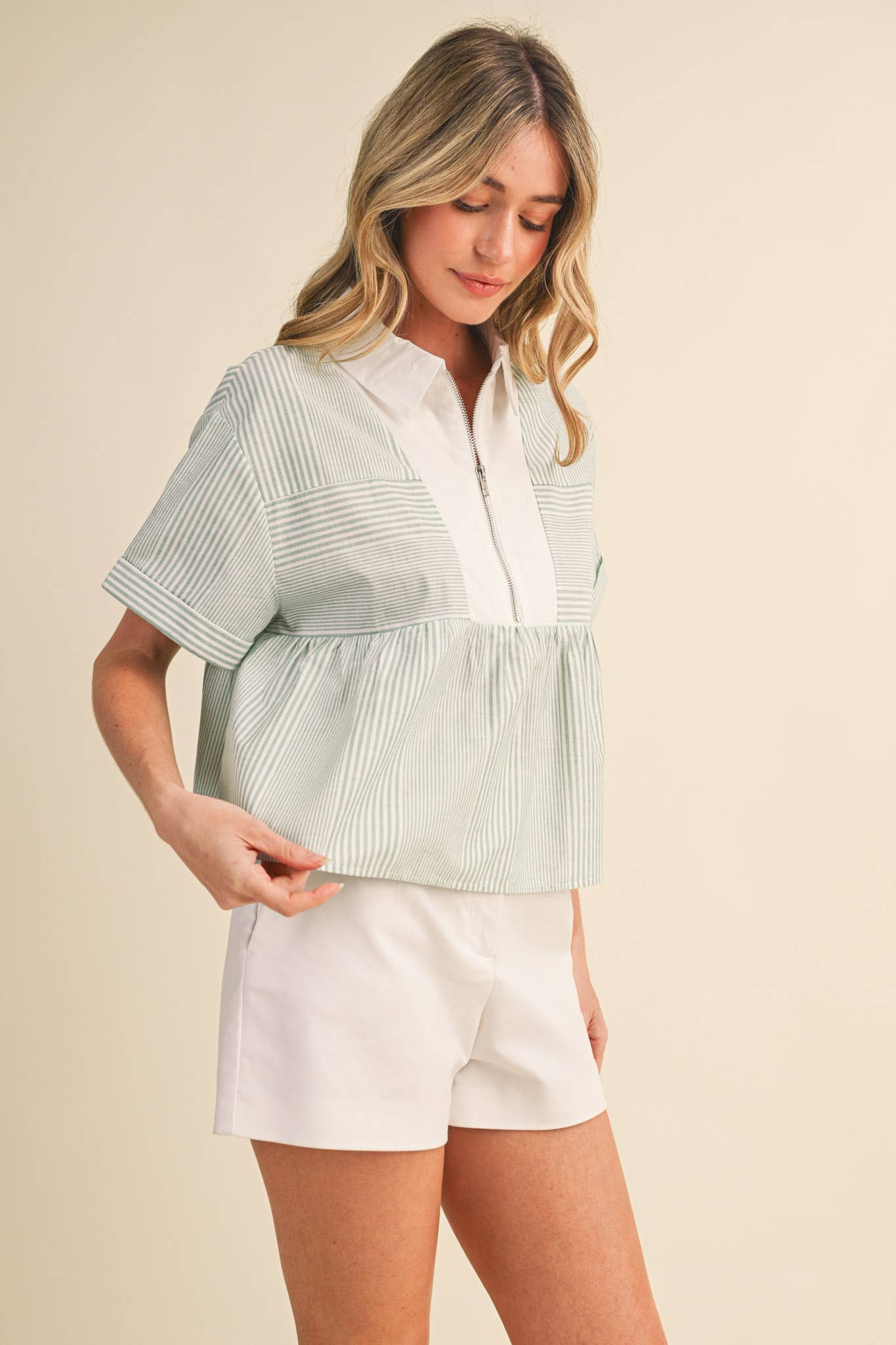 STRIPED HALF ZIP BABYDOLL TOP