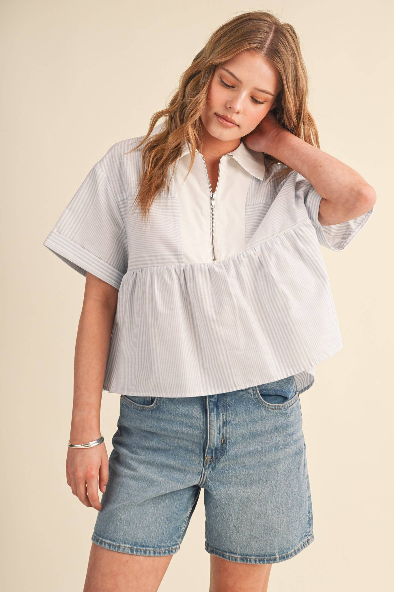 STRIPED HALF ZIP BABYDOLL TOP